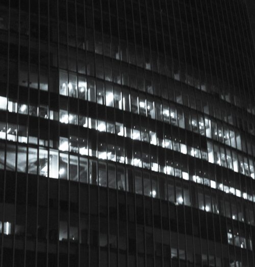 black and white building lit up