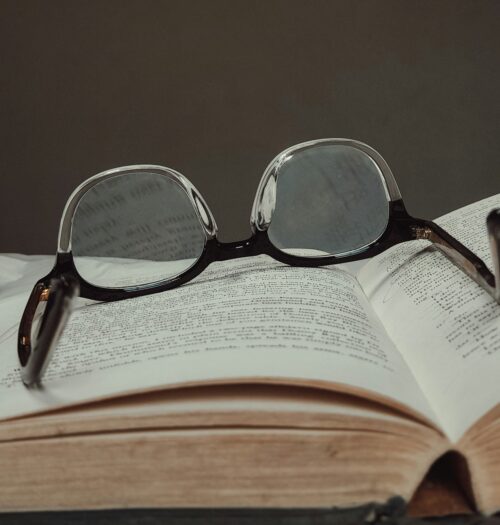 glasses on top of book