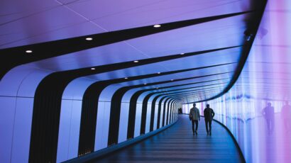 tunnel with silhouette of two people