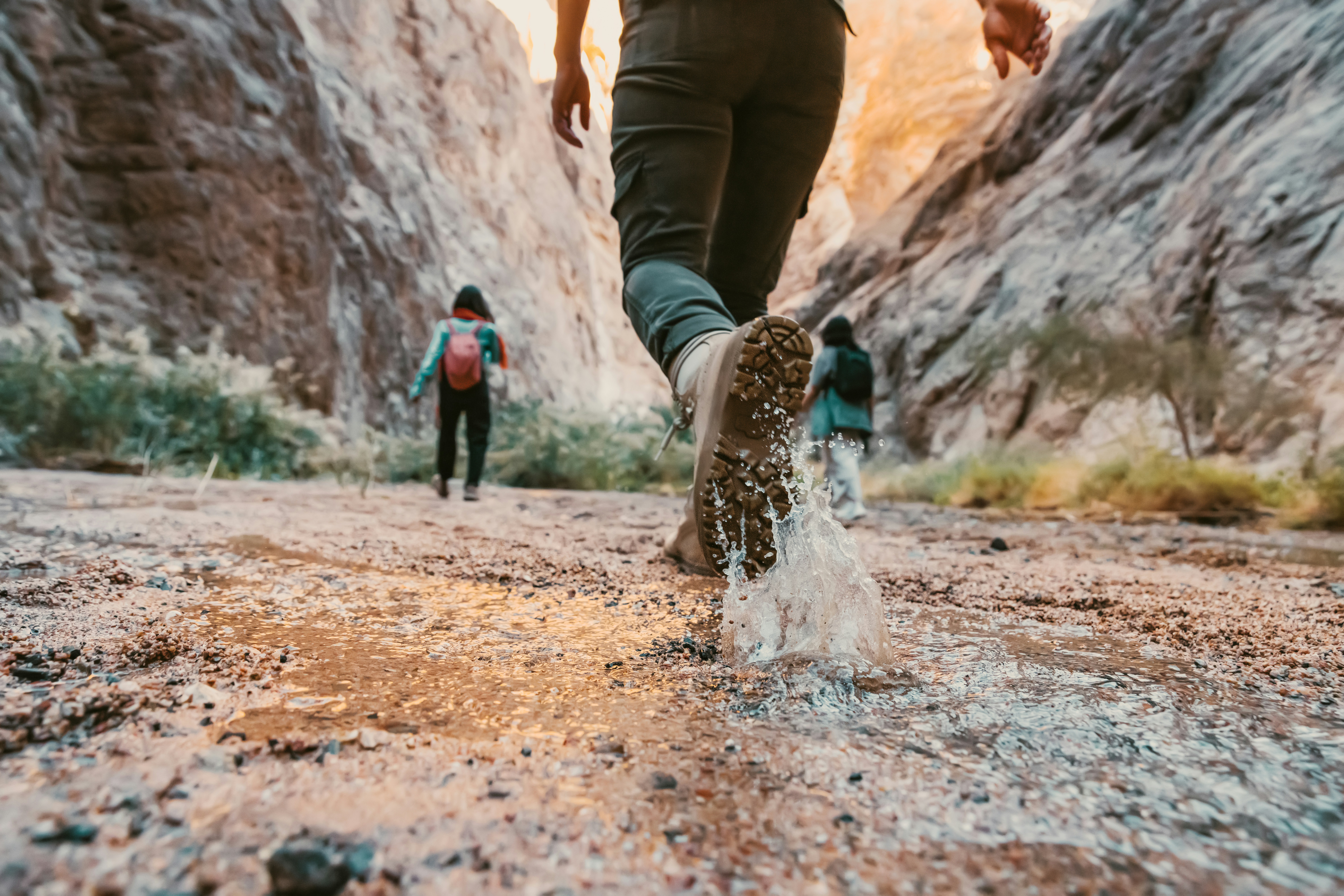 two people walking through outdoors