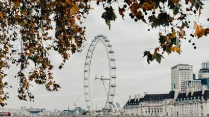 London skyline framed by autumn leaves
